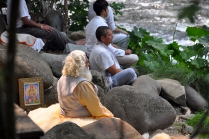 Yogiraj meditating with disciples at the Upper Sacramento River by Mt. Shasta.